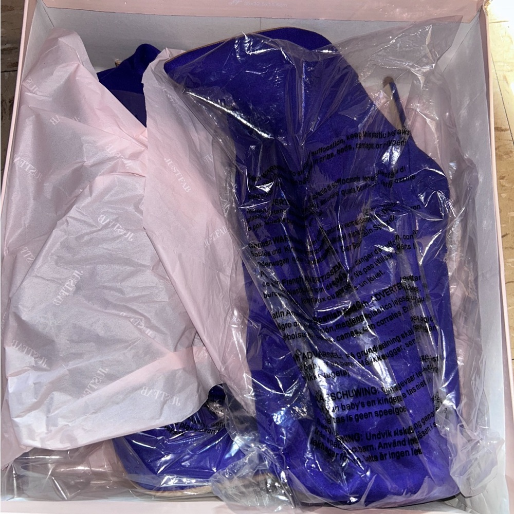 Vibrant different type of thigh high boots and ankle boots.